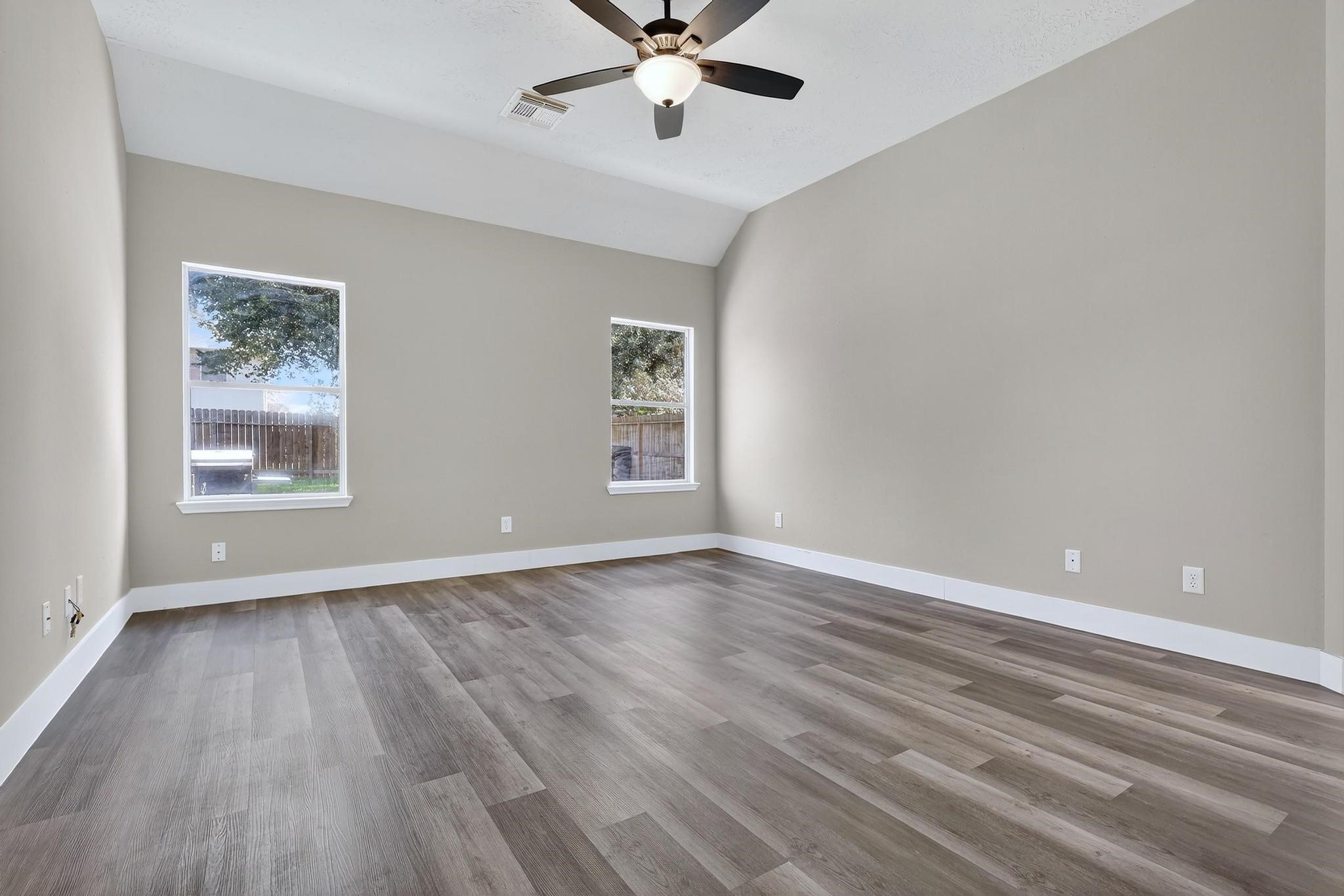 20926 Trellis Lane Houston, TX 77073 - Photo 7 of 22 Primary bedroom features laminate flooring and ample space with great views.