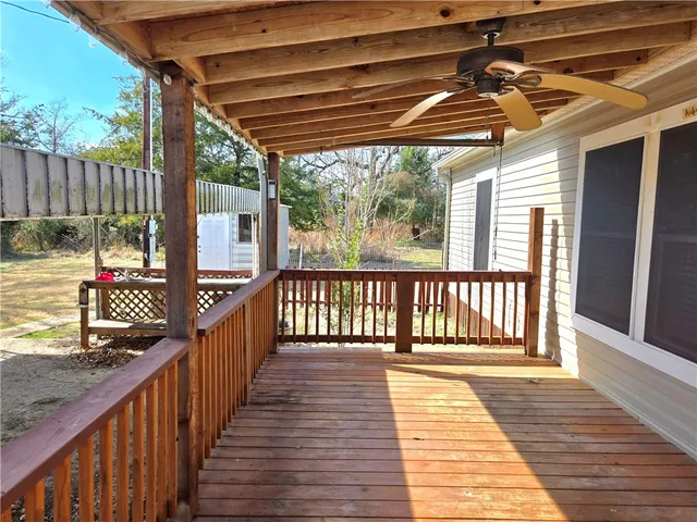 a view of a porch with wooden floor