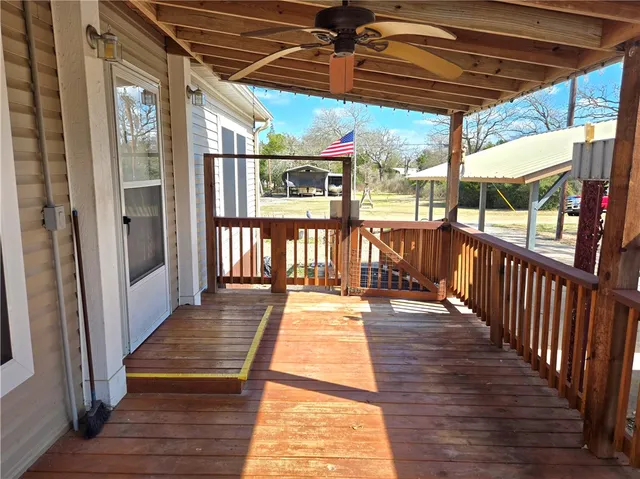 a view of a patio with wooden floor