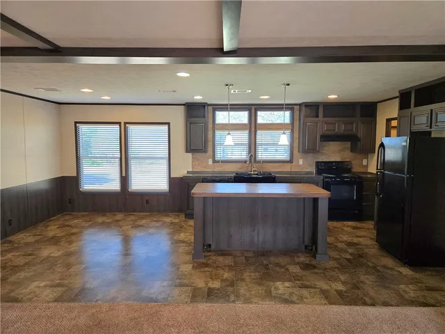 a living room with a couch and a large window