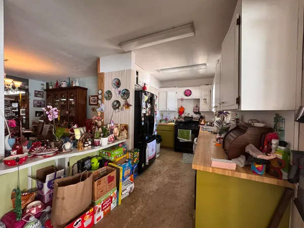 a kitchen filled with lots of fruit and vegetables
