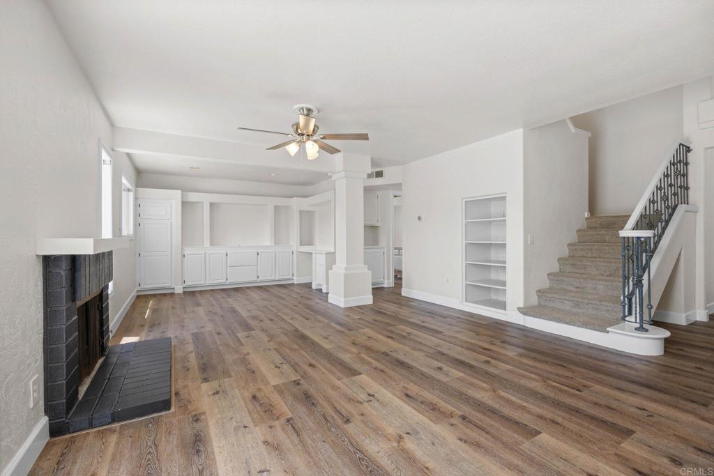 4595 Blackwell Road Oceanside, CA 92056 - Photo 19 of 47 wooden floor in an empty room with a fireplace