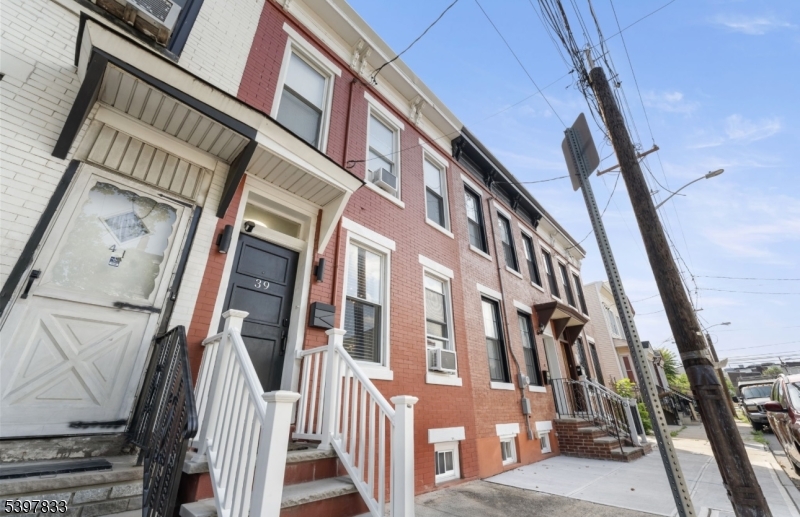 39 Emmet Street Newark, NJ 07114 - Photo 1 of 7 a view of an entryway with staircase