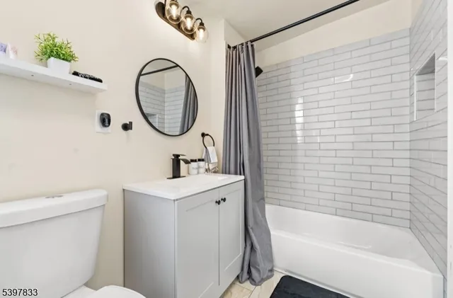 a bathroom with a sink a toilet and a bathtub