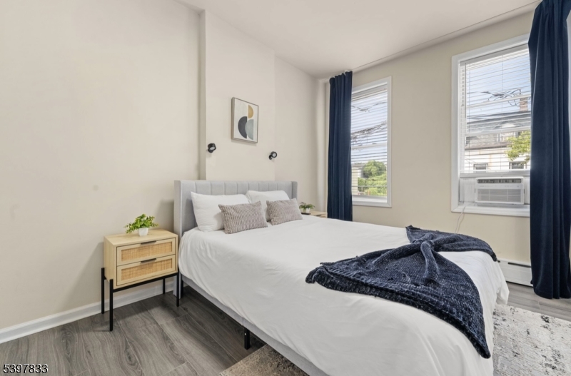 39 Emmet Street Newark, NJ 07114 - Photo 7 of 7 a bedroom with a bed and window