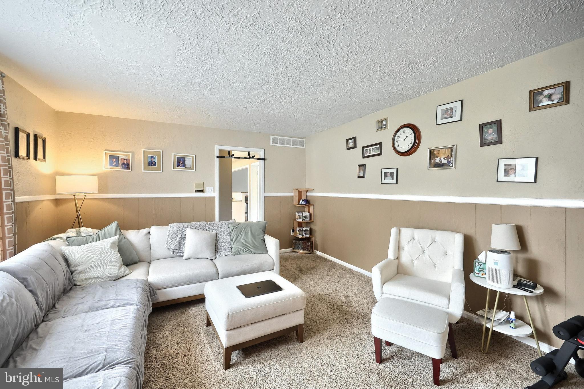 2420 Sutton Road York, PA 17403 - Photo 16 of 49 a living room with furniture and painting on the wall