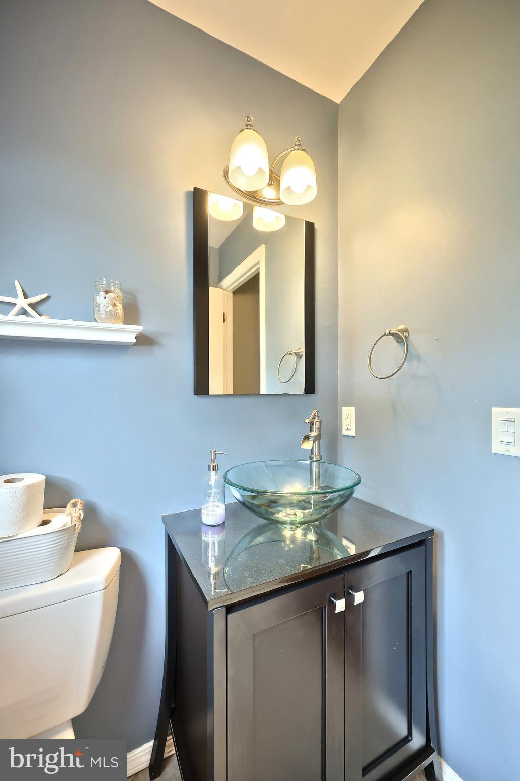 2420 Sutton Road York, PA 17403 - Photo 19 of 49 a bathroom with a toilet sink and mirror