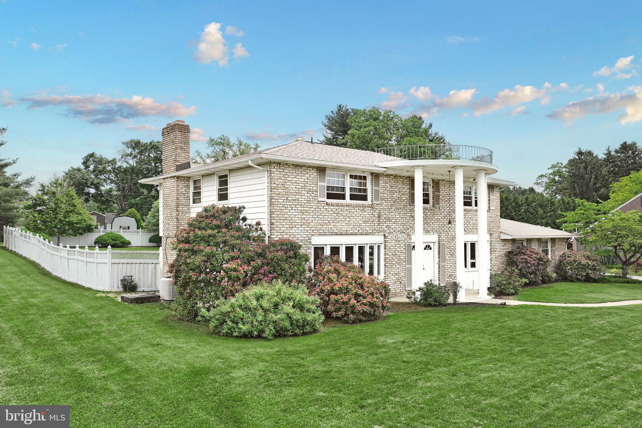 2420 Sutton Road York, PA 17403 - Photo 2 of 49 a front view of a house with a garden