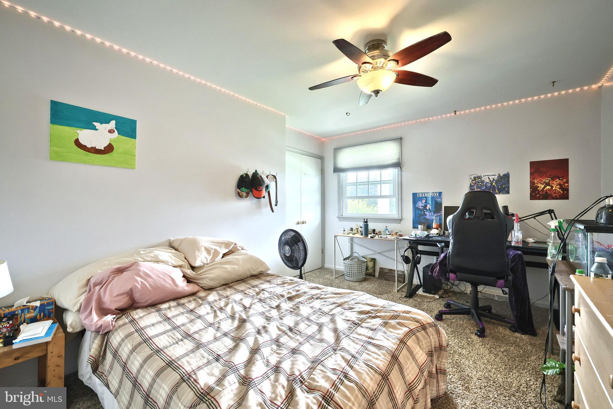 2420 Sutton Road York, PA 17403 - Photo 30 of 49 a bedroom with a bed and a chair