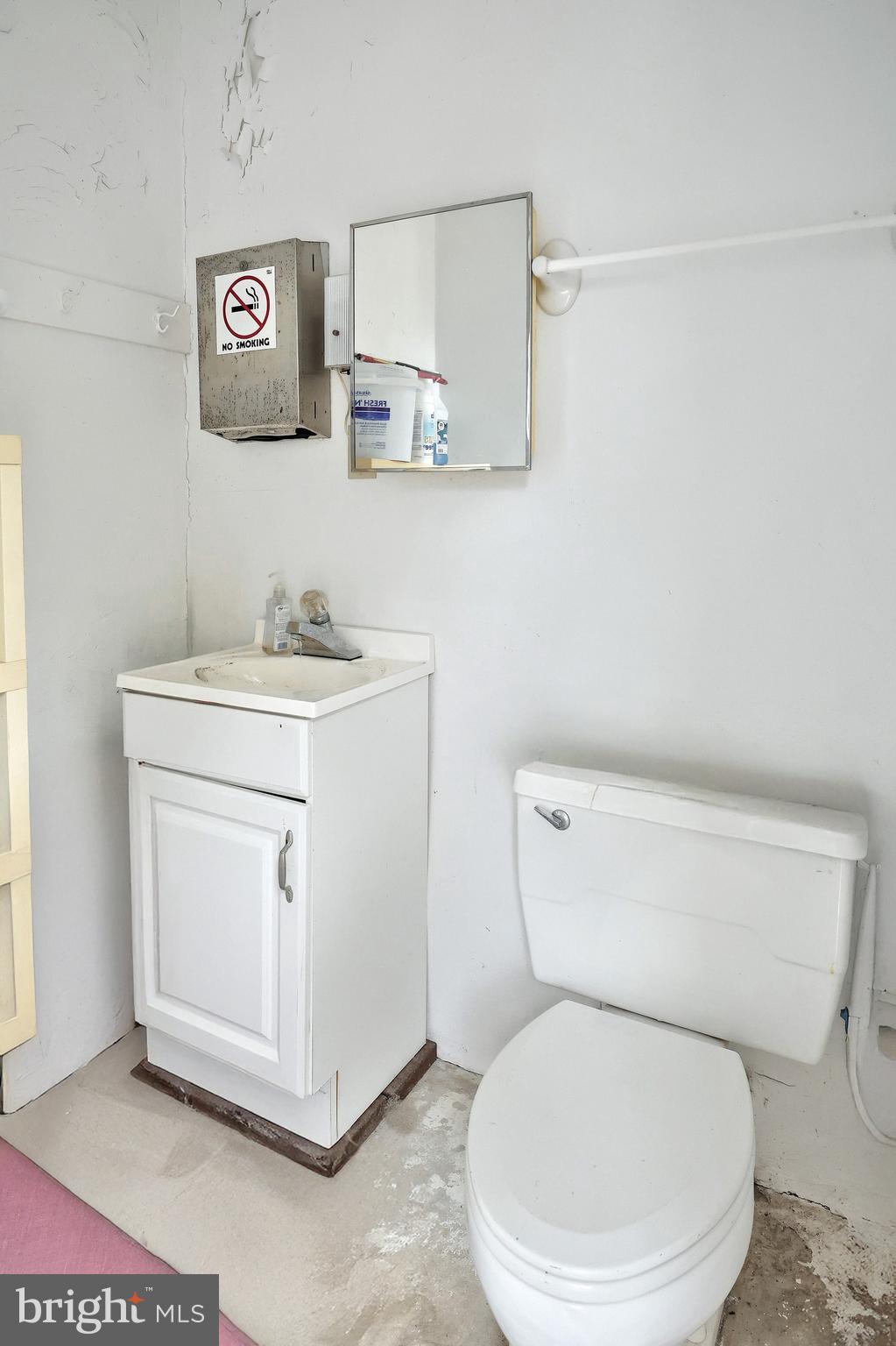 2420 Sutton Road York, PA 17403 - Photo 49 of 49 a white toilet sitting next to a bathroom sink