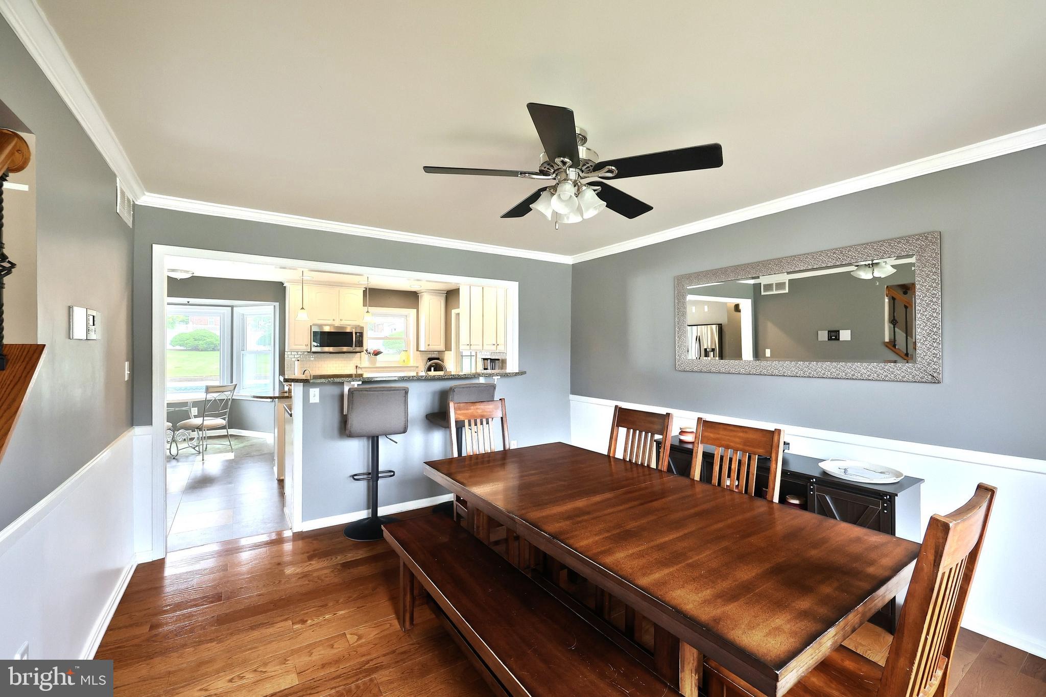 2420 Sutton Road York, PA 17403 - Photo 10 of 49 a view of a dining room with furniture window and wooden floor