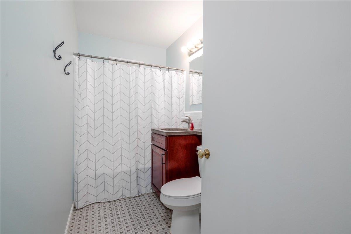 1660 Raymore Road Memphis, TN 38117 - Photo 21 of 30 Bathroom with a shower with curtain, vanity, and toilet