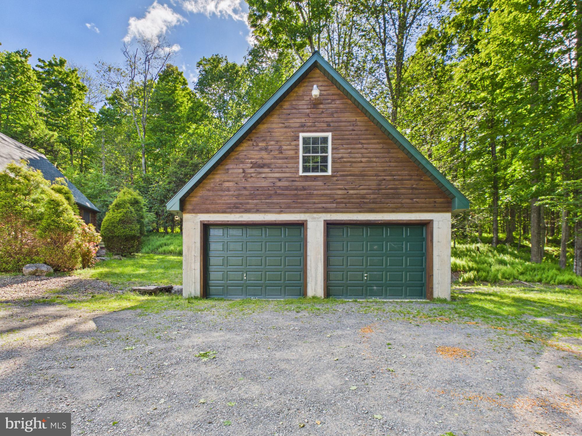 477 Finn Swamp Road Lakeville, PA 18438 - Photo 11 of 53 4 car tandem garage, 2nd floor storage.