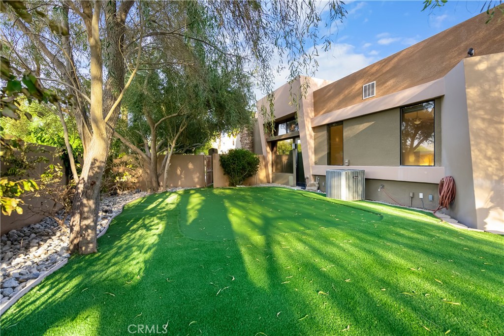 68 Royal St Georges Way Rancho Mirage, CA 92270 - Photo 17 of 75 a front view of a house with a yard