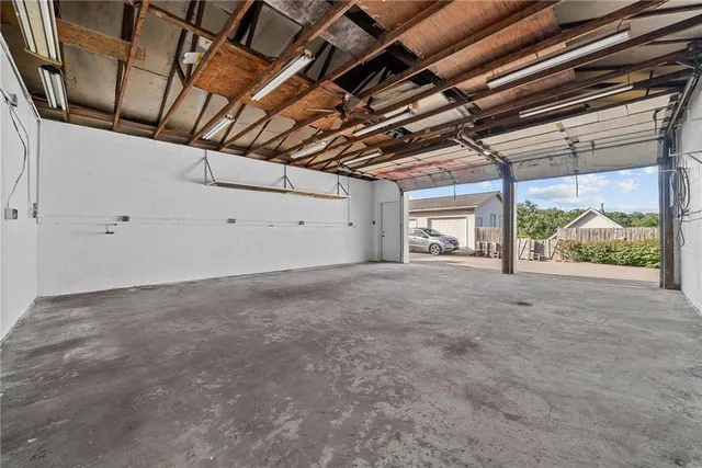 a view of a room with wooden walls