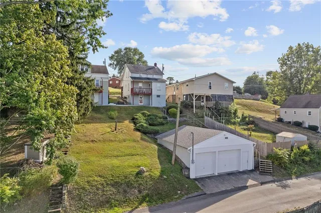 a view of a swimming pool with a garden and plants