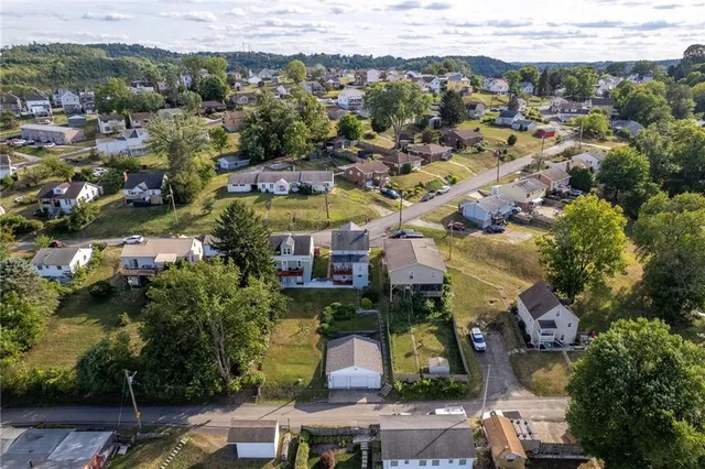 an aerial view of a city with lots of residential buildings
