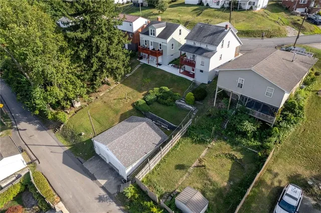 an aerial view of a house with a garden
