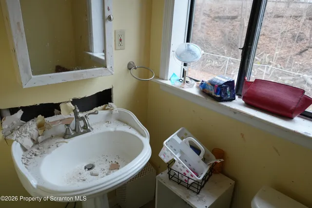 a view of a balcony with chair and swing