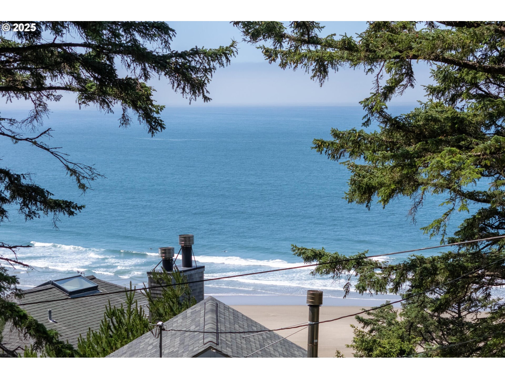 15 Chinook Avenue, Unit 5 Oceanside, OR 97134 - Photo 3 of 19 a view of a lake from a yard