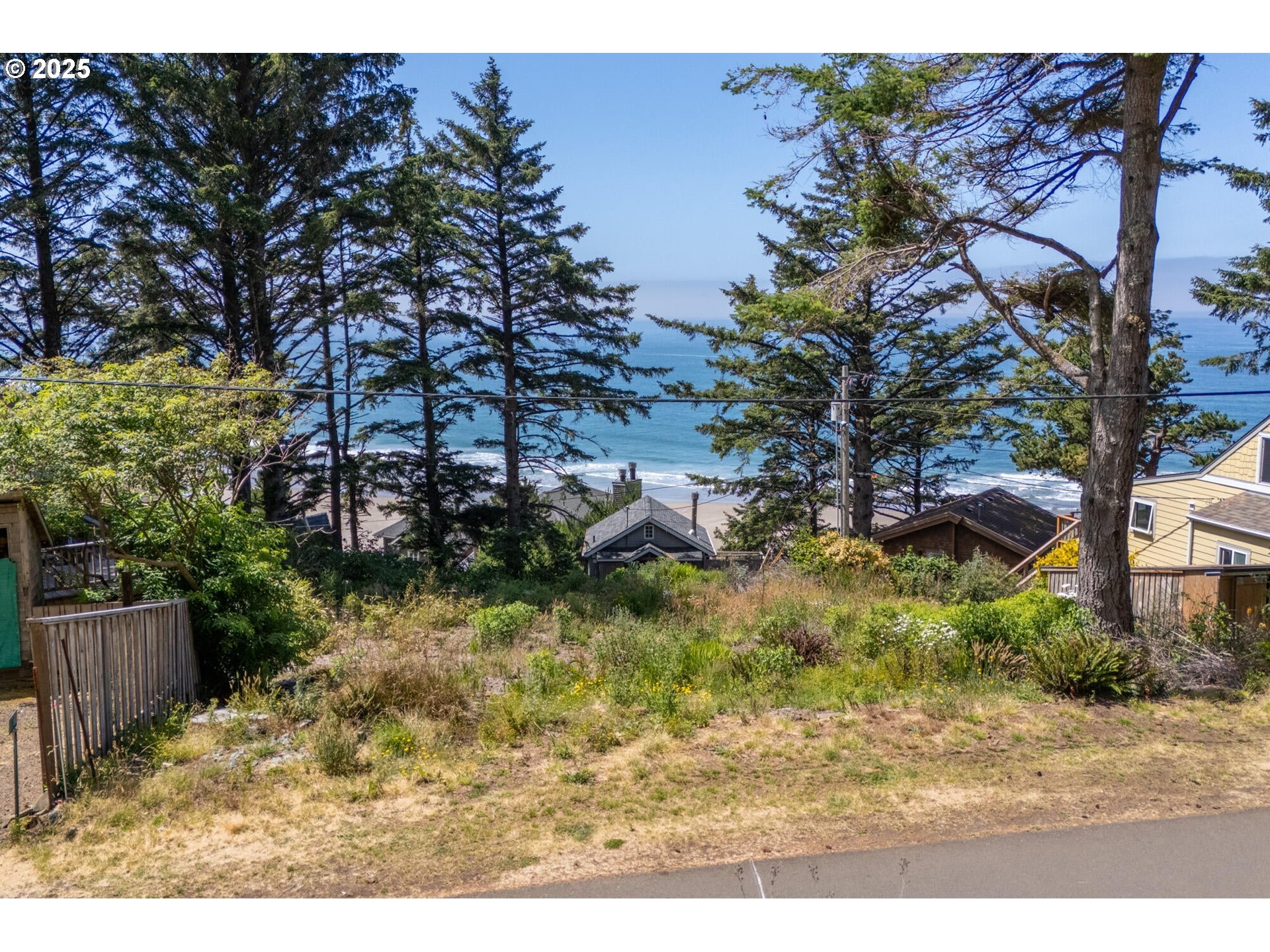 15 Chinook Avenue, Unit 5 Oceanside, OR 97134 - Photo 4 of 19 a backyard of a house with a yard and outdoor seating