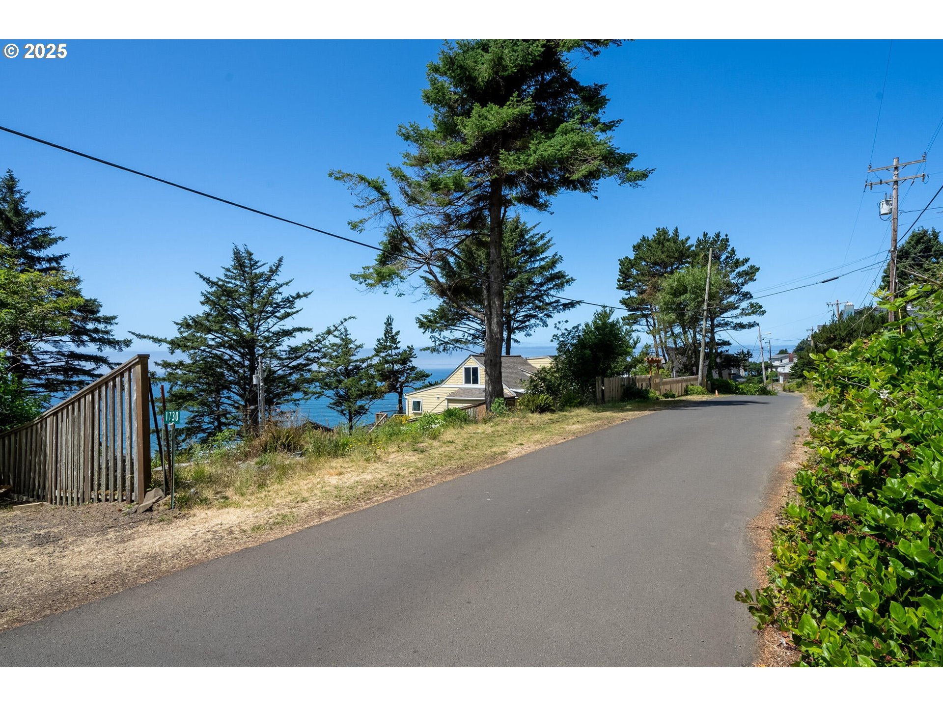 15 Chinook Avenue, Unit 5 Oceanside, OR 97134 - Photo 7 of 19 a view of a yard with a house