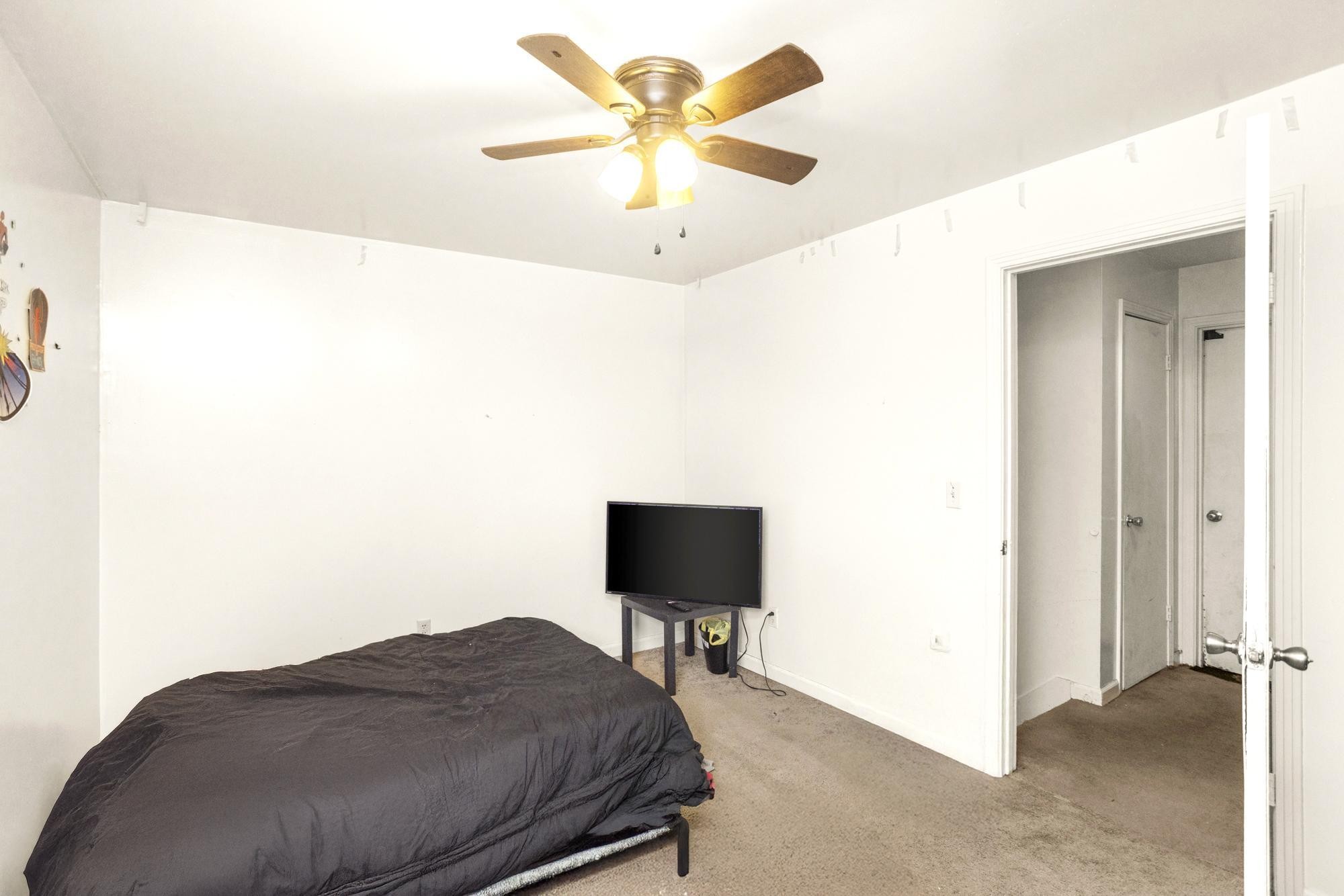 208 Leeshan Court Antioch, TN 37013 - Photo 11 of 31 a bedroom with a bed and a bookshelf