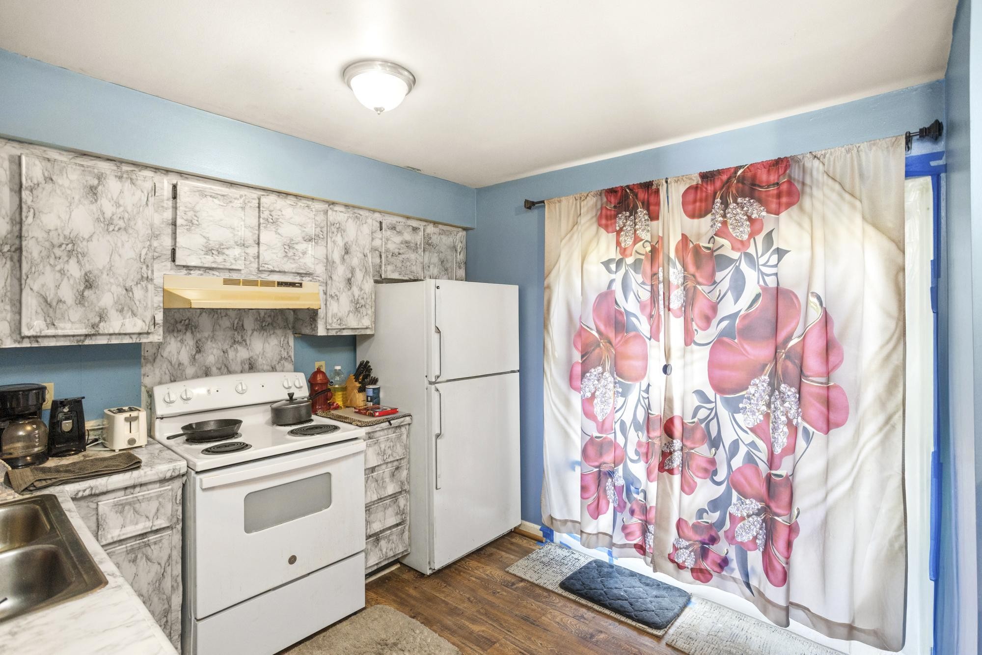 208 Leeshan Court Antioch, TN 37013 - Photo 15 of 31 a kitchen with stainless steel appliances a stove a sink and a refrigerator