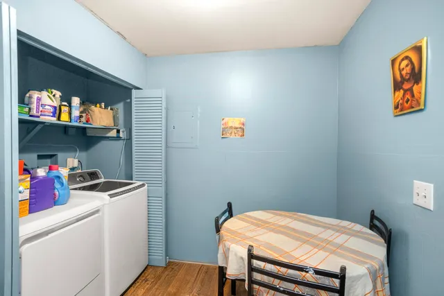 a bedroom with a bed and a tv