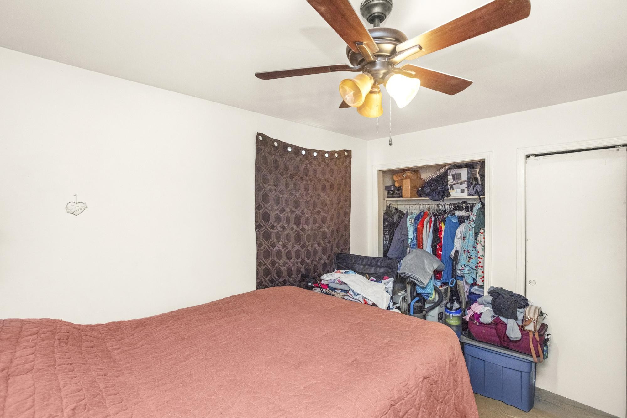 208 Leeshan Court Antioch, TN 37013 - Photo 25 of 31 a bedroom with a bed and a chandelier
