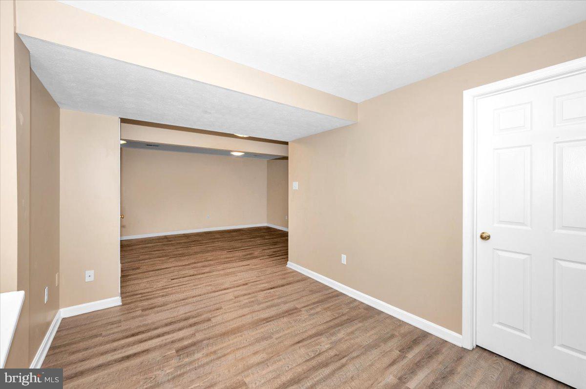 1184 Heathfield Road Sykesville, MD 21784 - Photo 27 of 56 a view of an empty room with wooden floor and closet