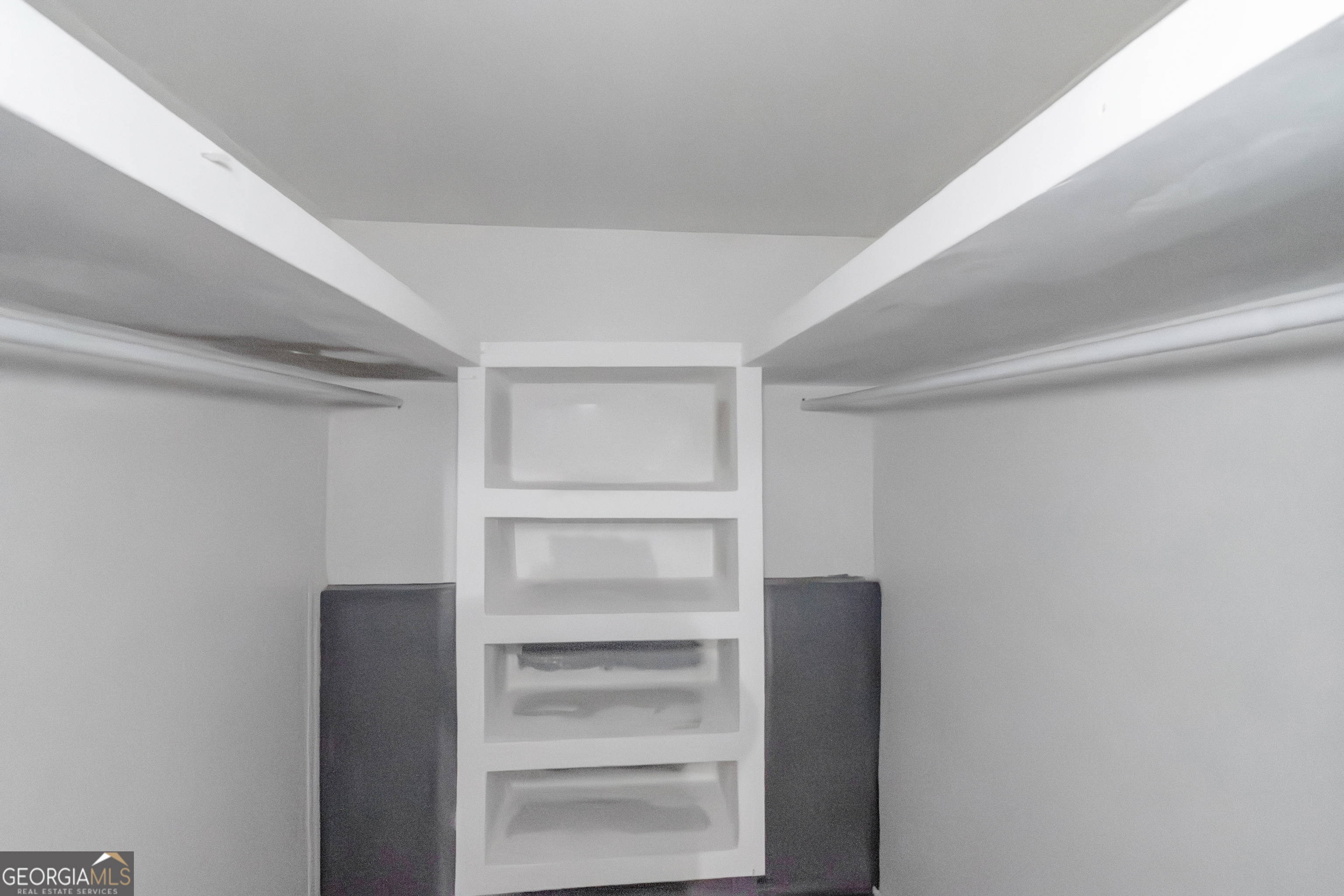 7600 Suwannee Court Jonesboro, GA 30236 - Photo 28 of 35 a view of walk in closet with empty racks
