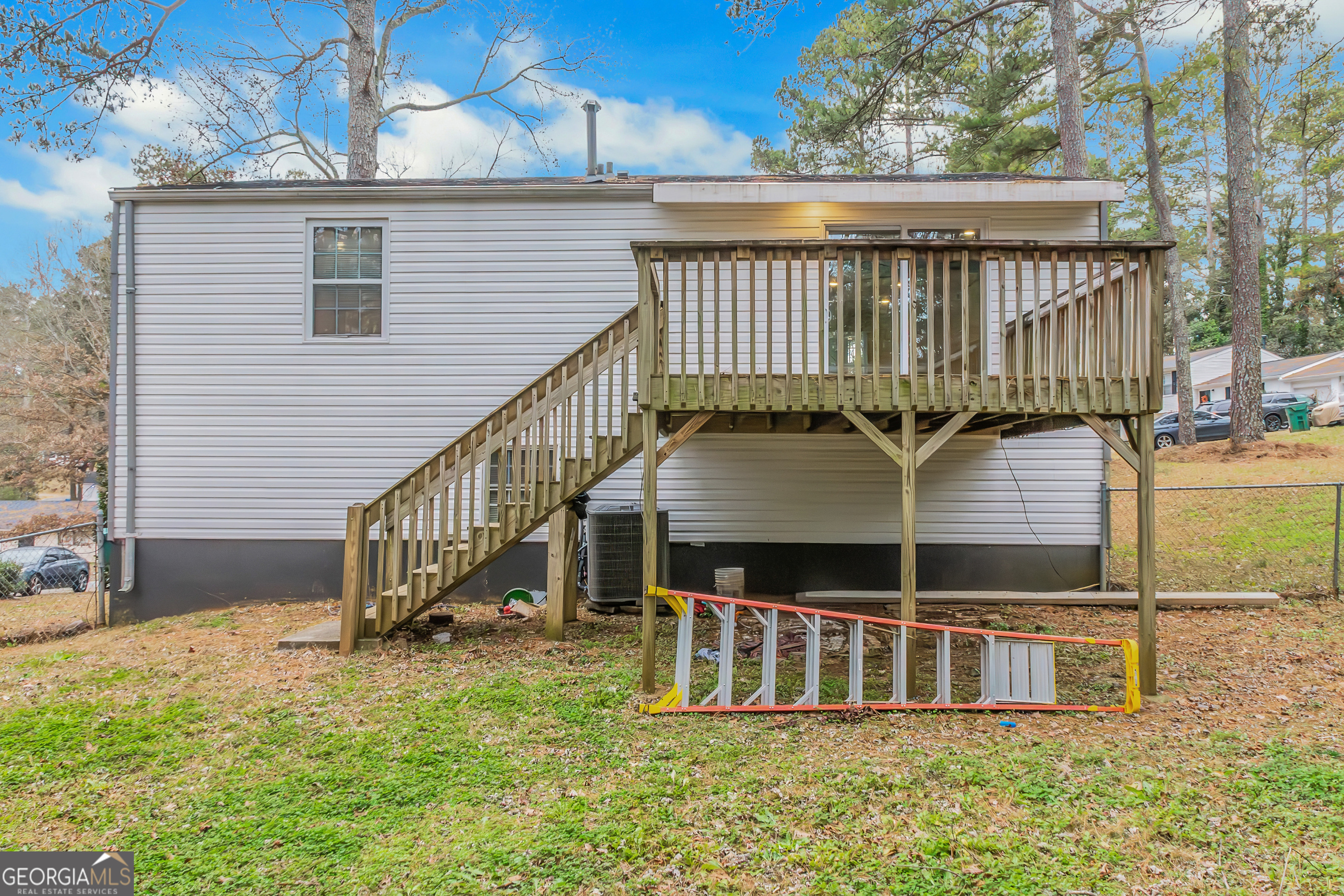 7600 Suwannee Court Jonesboro, GA 30236 - Photo 32 of 35 a view of a house with backyard and deck
