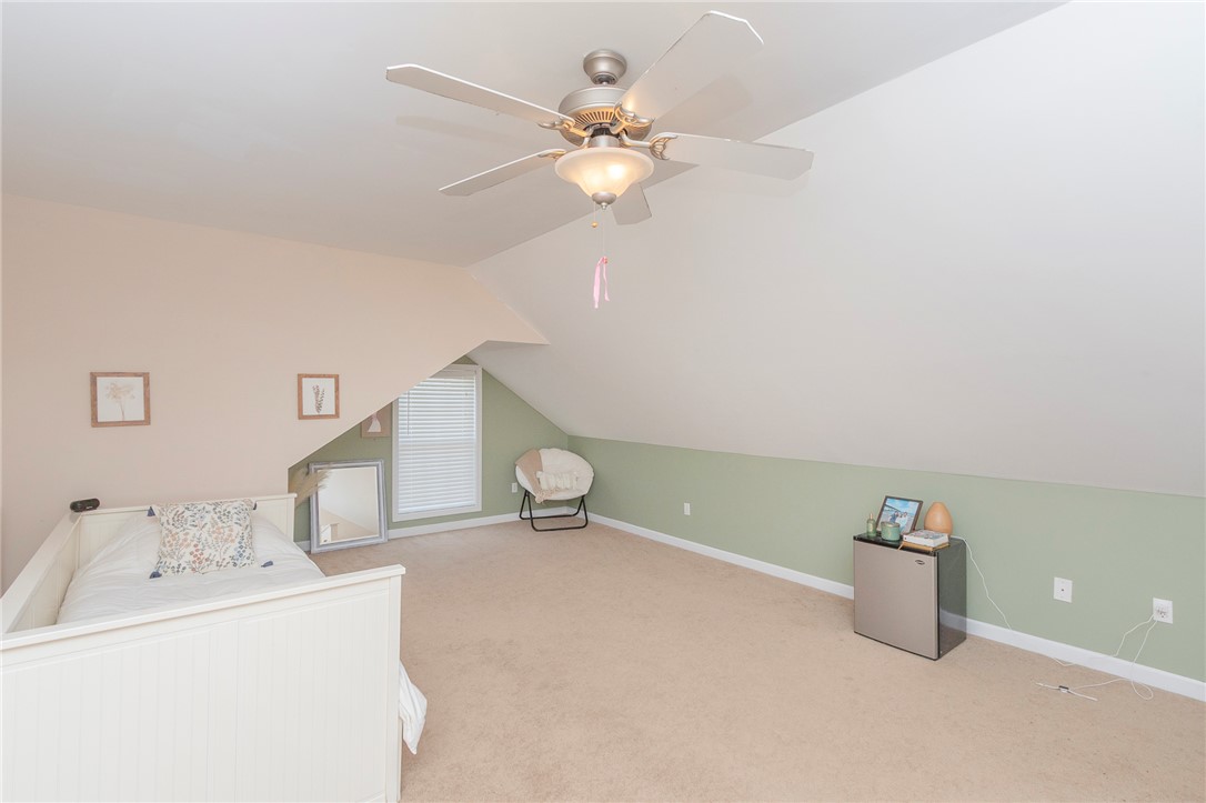 861 North Old Pendleton Road Liberty, SC 29657 - Photo 30 of 45 A cozy bedroom with sloped ceilings and ample space, perfect for quiet retreat.