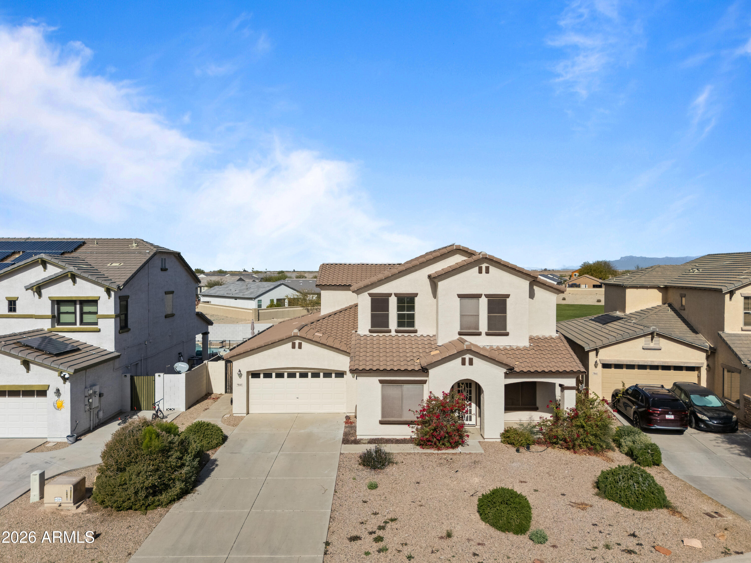 9840 Tangerine Road Florence, AZ 85132 - Photo 1 of 38 a front view of a house with a yard