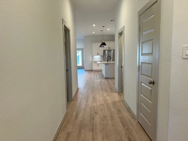 a view of a bedroom from a hallway