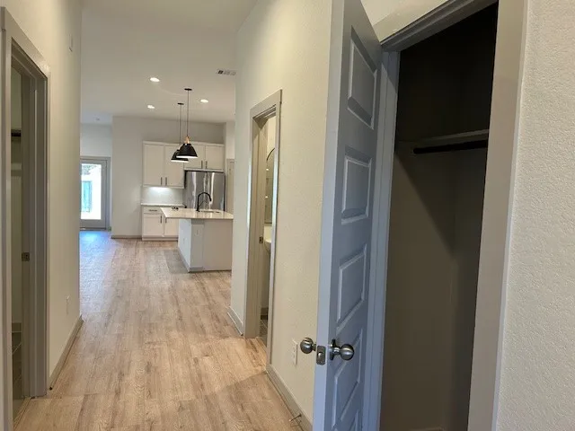 a view of a kitchen from the hallway