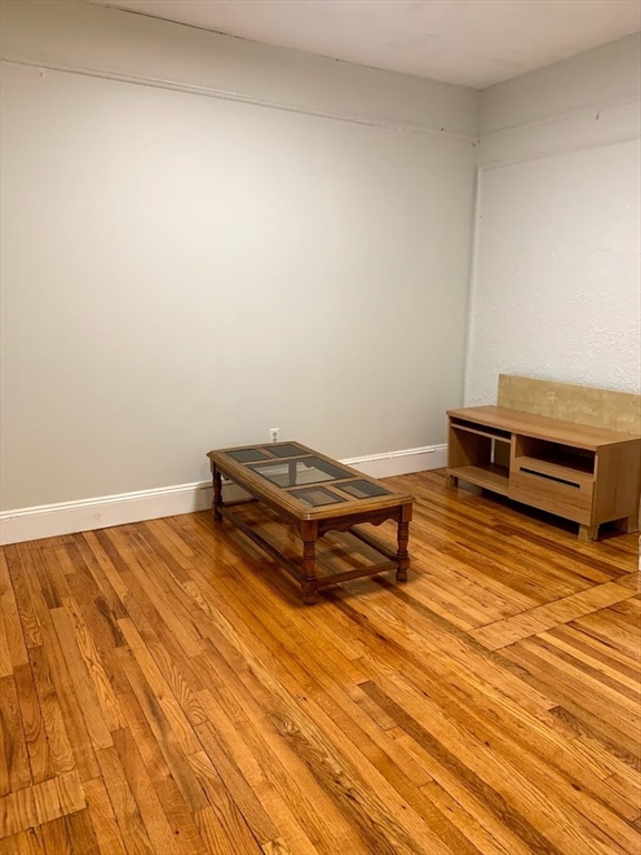 1691 Commonwealth Avenue, Unit 29 Boston, MA 02135 - Photo 8 of 8 a view of a room with wooden floor and pool table
