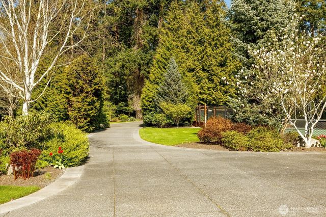 a view of a lake with a yard