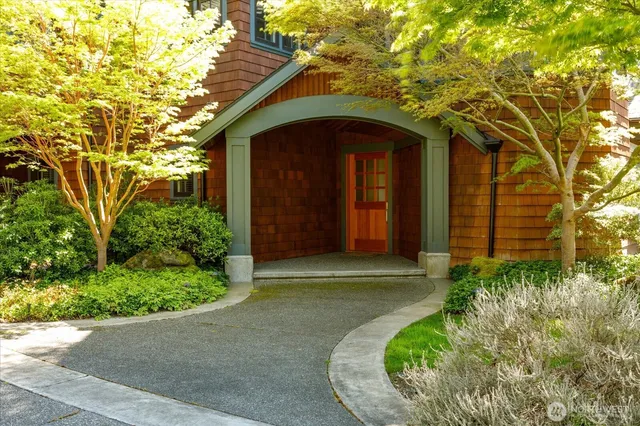 a view of entryway with wooden floor and stairs