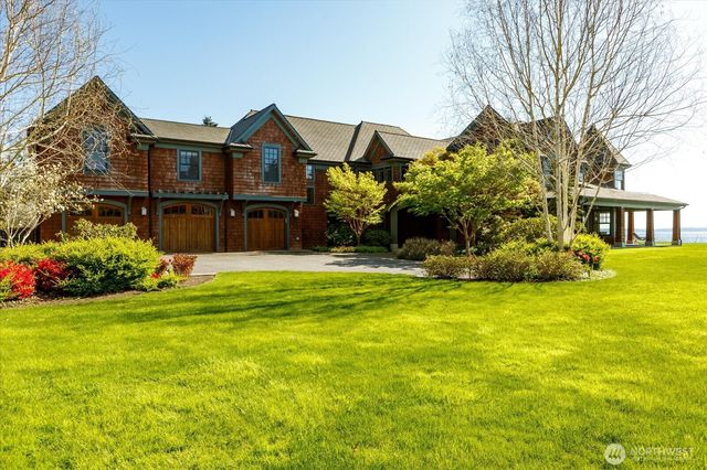 a view of a house next to a yard