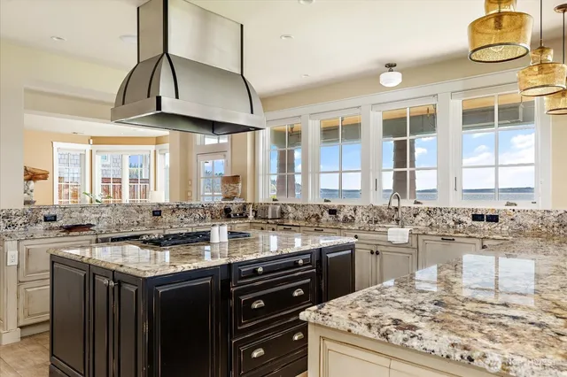 a kitchen with sink stove and cabinets