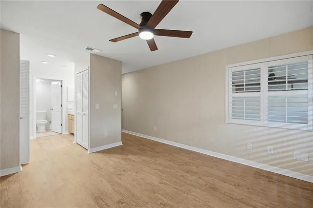 an empty room with a empty space and windows