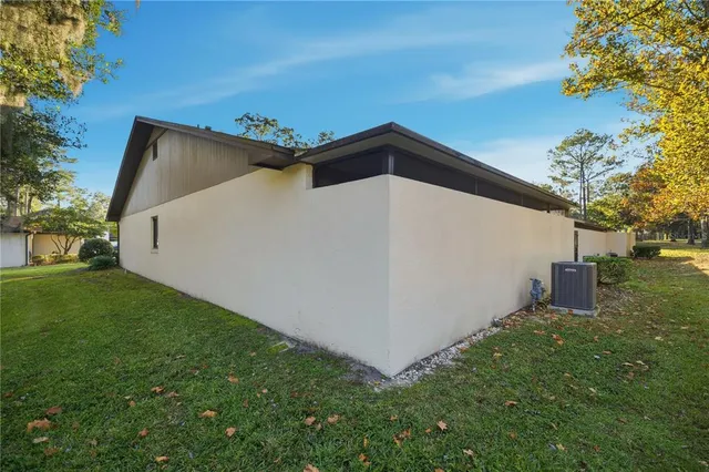 a backyard of a house with lots of green space