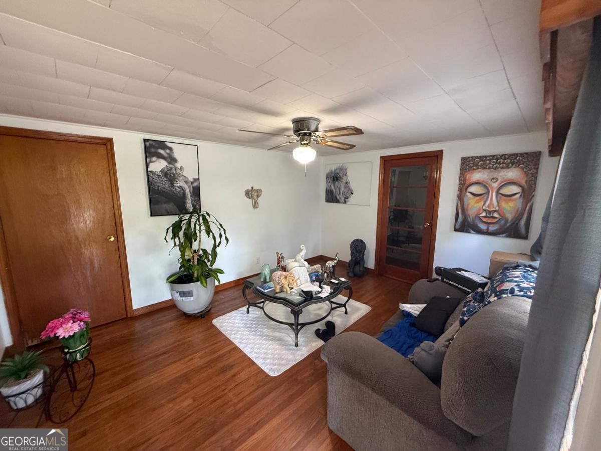 4510 Browns Bridge Road Gainesville, GA 30504 - Photo 3 of 13 a living room with furniture and flowers