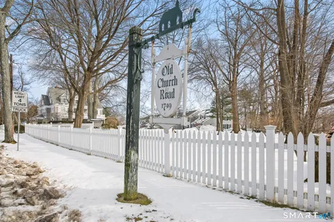 a street view with a wooden fence