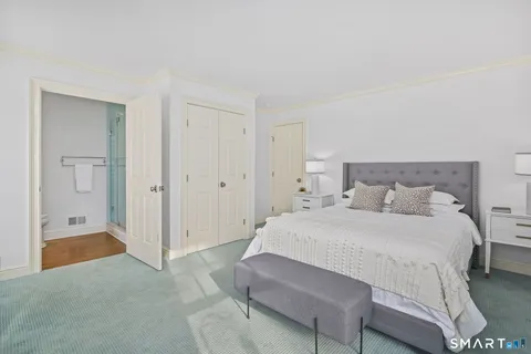 a bedroom with a bed and closet