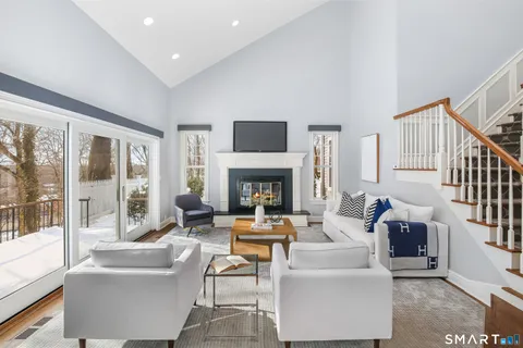 a living room with fireplace furniture and a fireplace