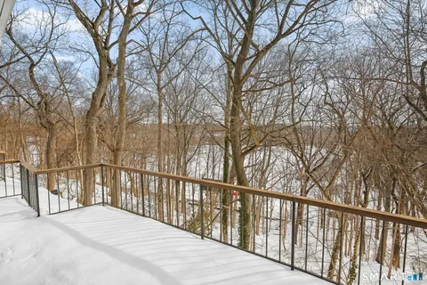 a view of a balcony with wooden fence