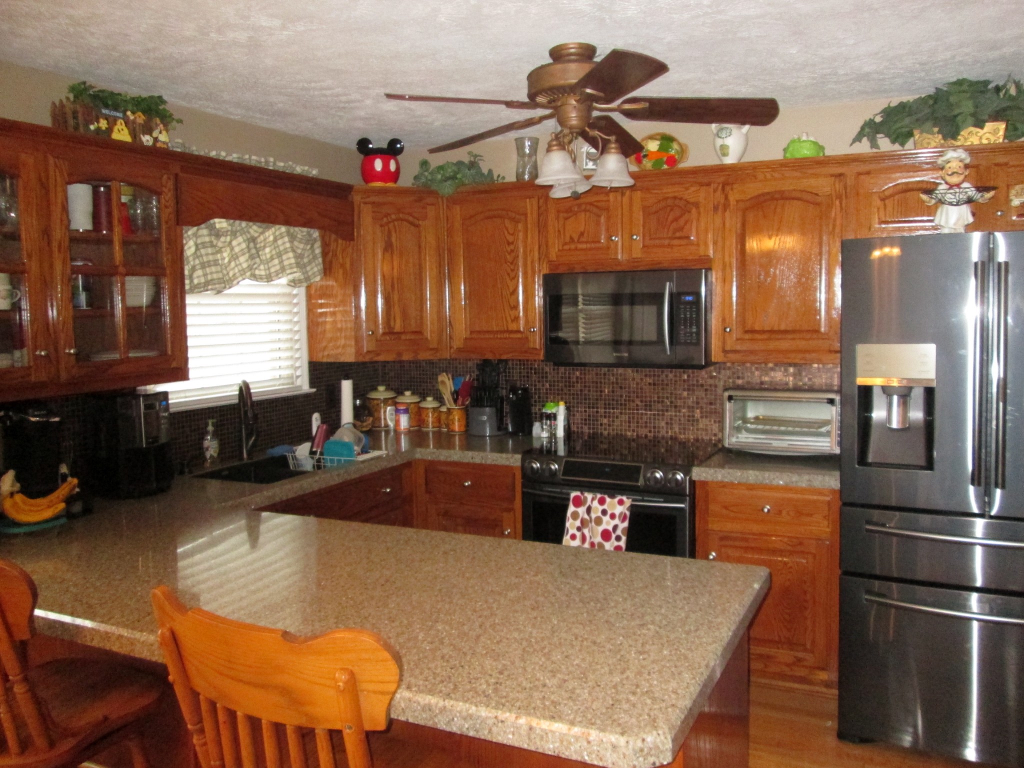 655 Philadelphia Road Lebanon, TN 37087 - Photo 9 of 20 a kitchen with a refrigerator and a stove top oven